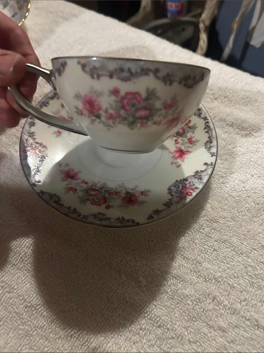 Meito "Corsage" pattern porcelain cup and saucer with floral decoration.